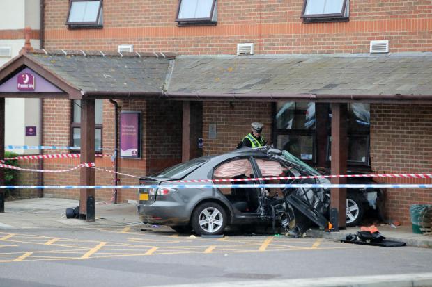 Woman in her 80s dies in hospital hours after her Mazda hit Premier Inn following lorry crash